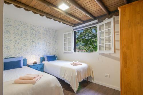 Ένα ή περισσότερα κρεβάτια σε δωμάτιο στο Villa Los Matos Pool and garden