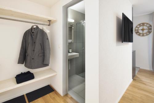 a small bathroom with a walk in shower at EH Apartments Mars in St. Gallen