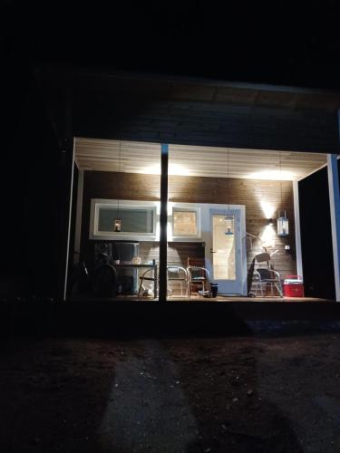 a view of a kitchen from a window at night at Pikkuporo in Syöte