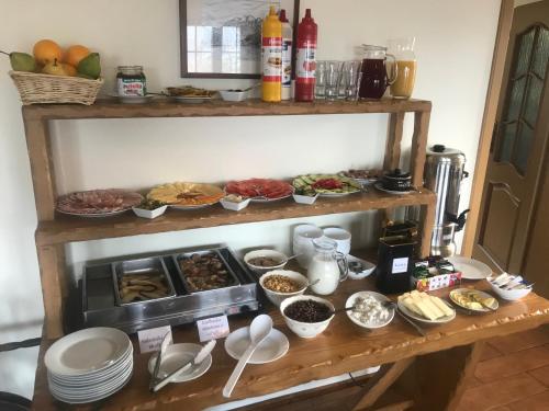 a table with many different types of breakfast foods at Mileżówka - Noclegi&SPA in Ustroń