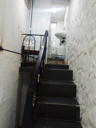 a set of stairs in a room with a stair case at Villa mar in Puerto Colombia