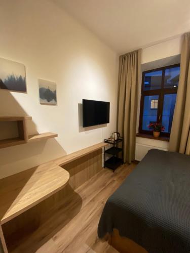 TV a/nebo společenská místnost v ubytování Yellow Ski Apartments