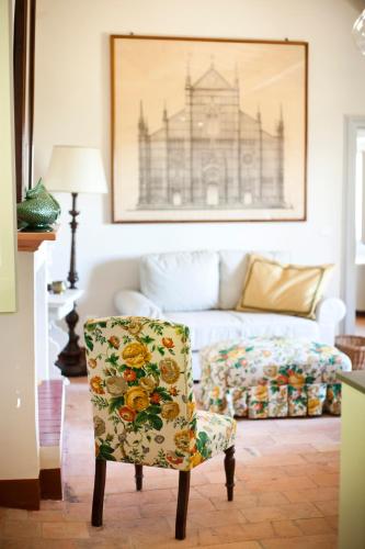 a living room with a chair and a couch at San Martinello in Perugia