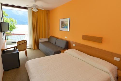 Postel nebo postele na pokoji v ubytování Hotel Lido