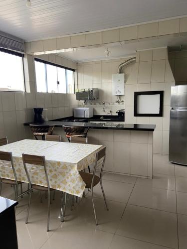 a kitchen with a table and chairs in it at Casas Borges in Torres