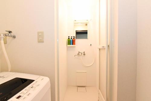 a small bathroom with a toilet and a sink at Heights N7 / Vacation STAY 7573 in Sapporo