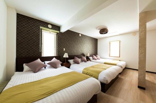 Un pat sau paturi într-o cameră la Hongo Street House - Vacation STAY 8636