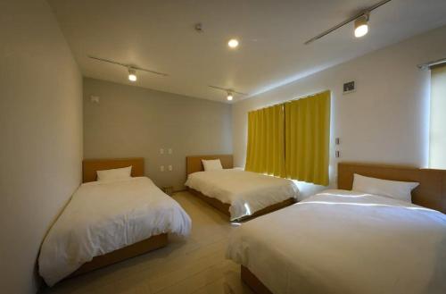 Ένα ή περισσότερα κρεβάτια σε δωμάτιο στο SAKURA93 / Vacation STAY 80598