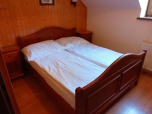 Tempat tidur dalam kamar di Ranč Kostelany