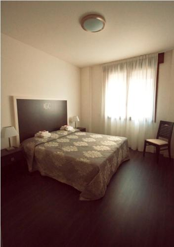 Letto o letti in una camera di Hotel Giulio Cesare