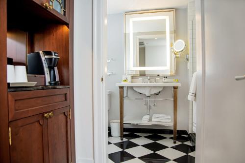 a bathroom with a sink and a mirror at InterContinental New York Barclay Hotel by IHG in New York