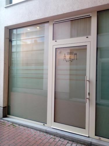 a garage door with a sign on it at STUDIO61 in Ghent