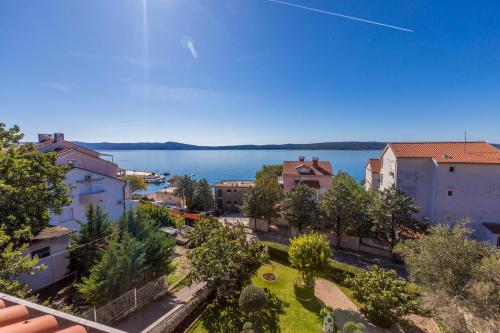 an aerial view of a city with a body of water at Ivan & Anka apartments BOJKO in Selce