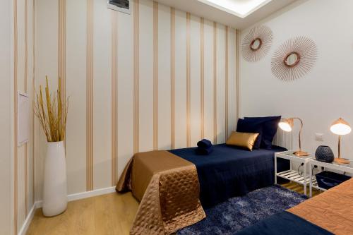 Una cama o camas en una habitación de Budapest Holidays Fashion