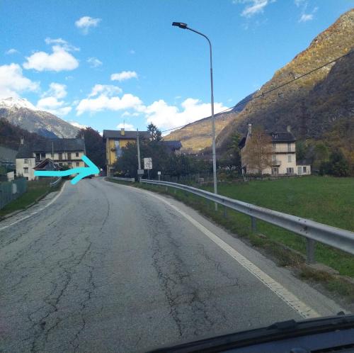 an empty road with a street light on the side at STONE in Crodo