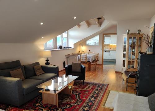 a living room with a couch and a table at Ferienwohnung Imberger Horn - Sonthofen in Sonthofen