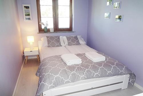Posteľ alebo postele v izbe v ubytovaní Holiday Hill Apartamenty Neli