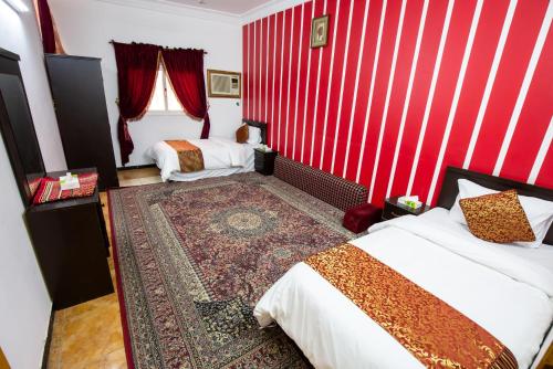 Een bed of bedden in een kamer bij العييري للوحدات المفروشة الباحة 1