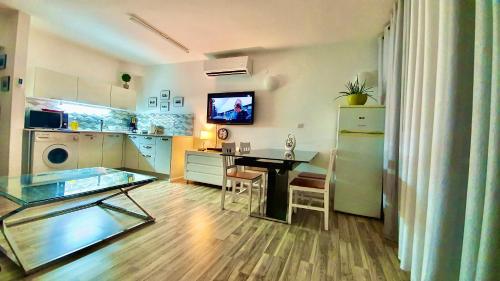 a kitchen with a table and a dining room at VIP suits Eilat in Eilat