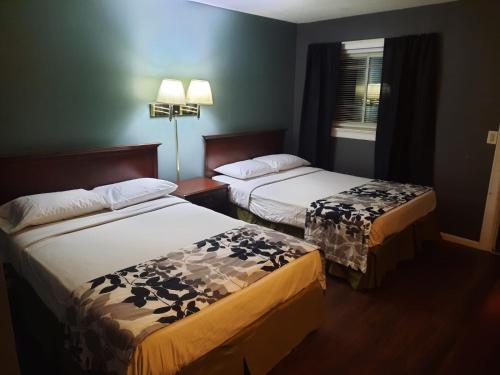 Postel nebo postele na pokoji v ubytování Tennessee Motel