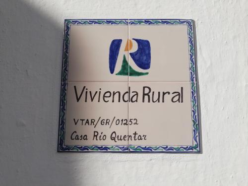 a sign for arizona rival on a wall at Casa Río Quentar in Quéntar