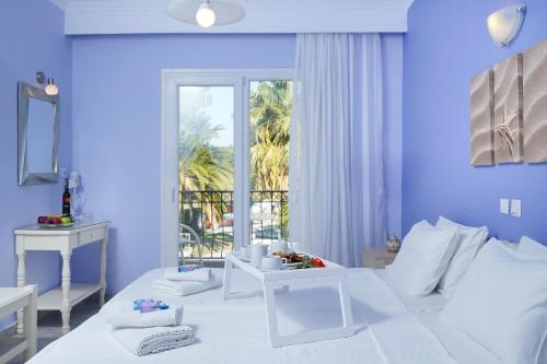 Ένα ή περισσότερα κρεβάτια σε δωμάτιο στο Eleani Hotel