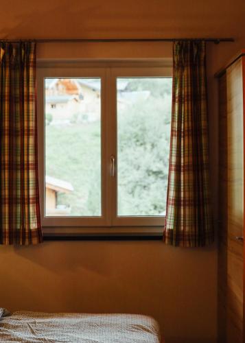 a window in a bedroom with a view of the water at Siegi's Apartments in Hof