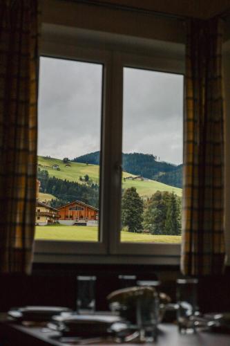 a window with a view of a green field at Siegi's Apartments in Hof