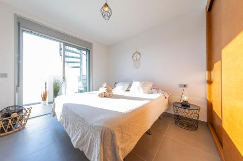 Кровать или кровати в номере MEDANO4YOU The Casa Celou Penthouse
