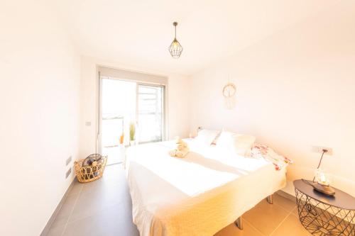 Кровать или кровати в номере MEDANO4YOU The Casa Celou Penthouse