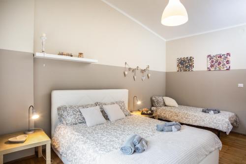 Katil atau katil-katil dalam bilik di Spazioso ed accogliente a pochi passi dal centro