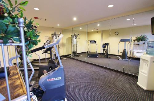 a gym with a mirror and a treadmill at Baymont by Wyndham Flagstaff in Flagstaff