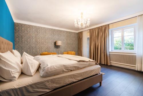 Postel nebo postele na pokoji v ubytování Renoviertes Bauernhaus mit Garten in Ruhelage