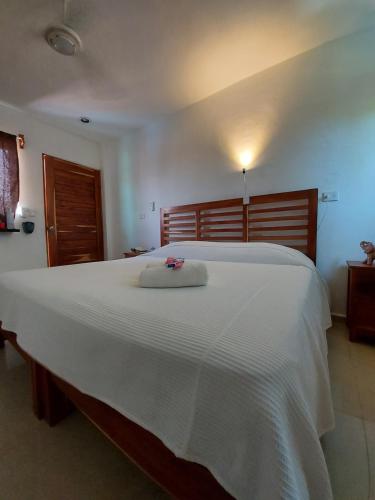 En eller flere senge i et værelse på Casa Ka'an Rio.