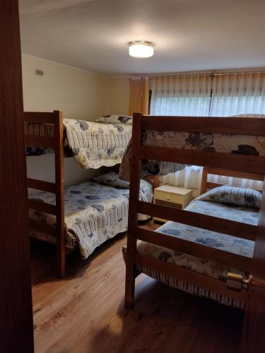 Ένα ή περισσότερα κρεβάτια σε δωμάτιο στο Cabañas Amancay