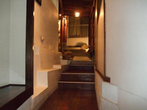 Postel nebo postele na pokoji v ubytování Marunaka Ryokan