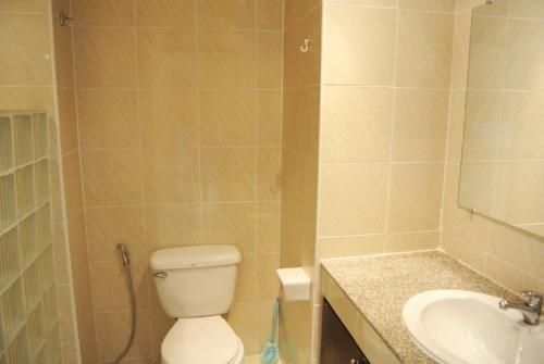 a bathroom with a toilet and a sink at View Talay 5 studio apartment - close to the beach in Pattaya South