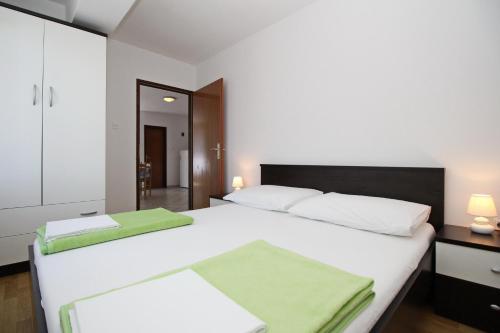 Posteľ alebo postele v izbe v ubytovaní Apartments Mohar II