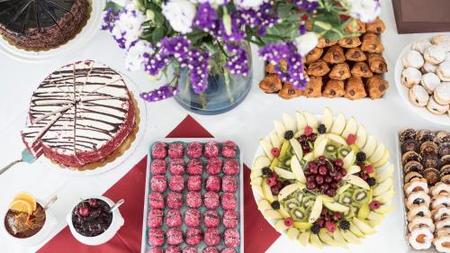 a table with various desserts and other food on it at Hotel Enzo Moro in Sùtrio