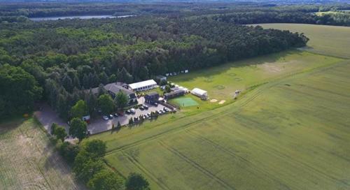 an aerial view of a farm with a group of people at Hotel Rezydencja Solei in Poznań