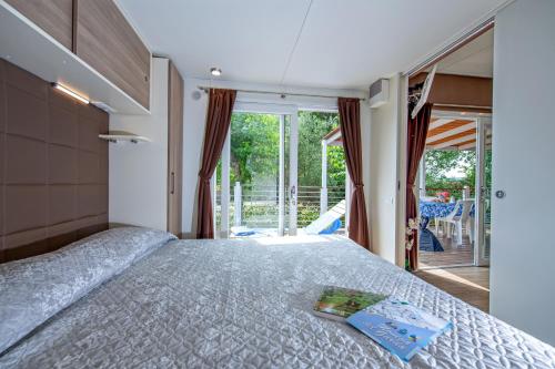 Postel nebo postele na pokoji v ubytování Camping Porto srl