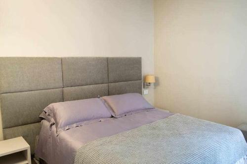Un pat sau paturi într-o cameră la Orta Paradise 26