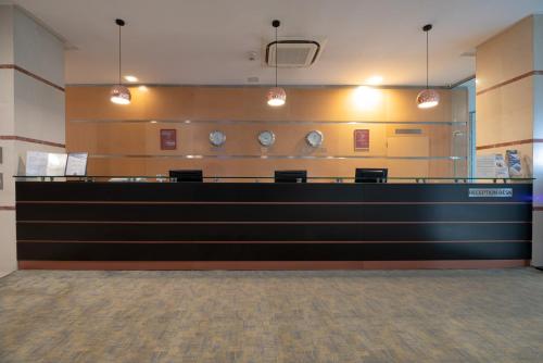 a lobby with a long counter in a building at Vitosha Park Hotel in Sofia