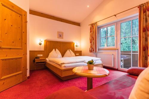 Posteľ alebo postele v izbe v ubytovaní Hotel Der Schmittenhof