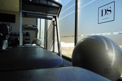 a gym with a pilates ball on a table at DS Hotel Lusopark in Santa Maria da Feira