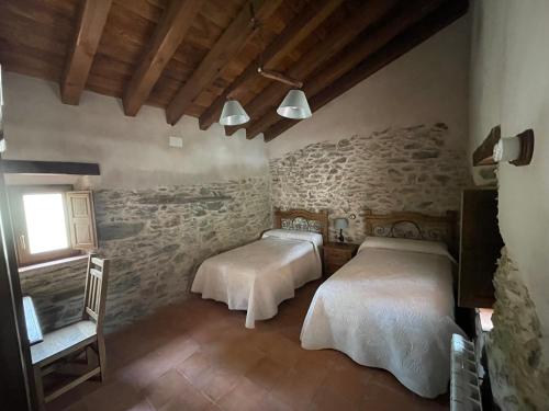 Posteľ alebo postele v izbe v ubytovaní Casa Rural Las Lanchas