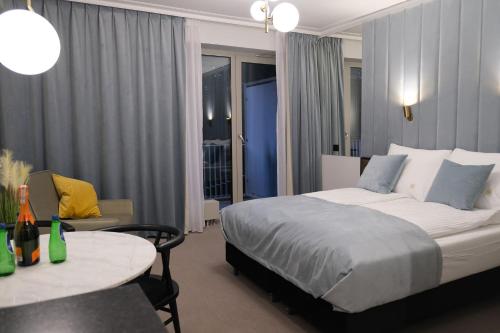 Postel nebo postele na pokoji v ubytování Blue Horizon Apartments