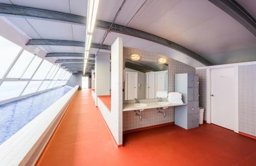 a bathroom with a sink and a mirror at Hotel Castellon Center Affiliated by Meliá in Castellón de la Plana