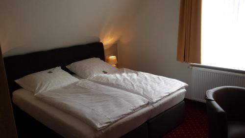 Una cama o camas en una habitación de Hotel Bohlje