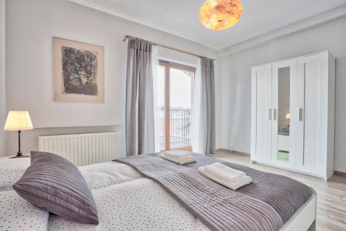 Postel nebo postele na pokoji v ubytování Family Apartment by Tyzenhauz
